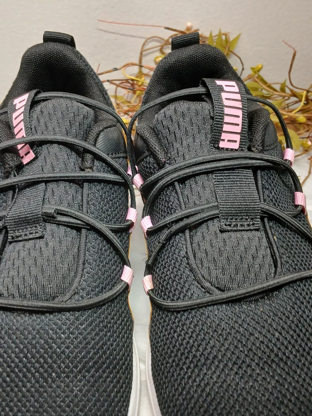 Puma Black Sneakers with Pink Accents and Orange Trim